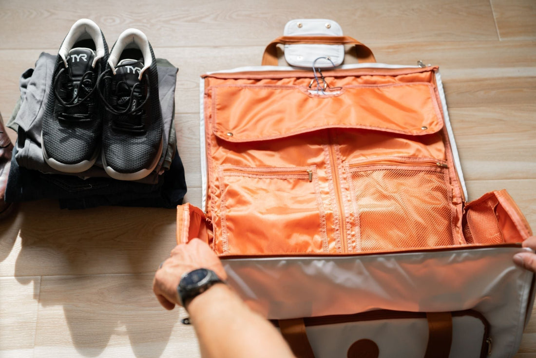 Lightweight adventure bag being packed with sneakers, emphasizing mobile travel and organization.