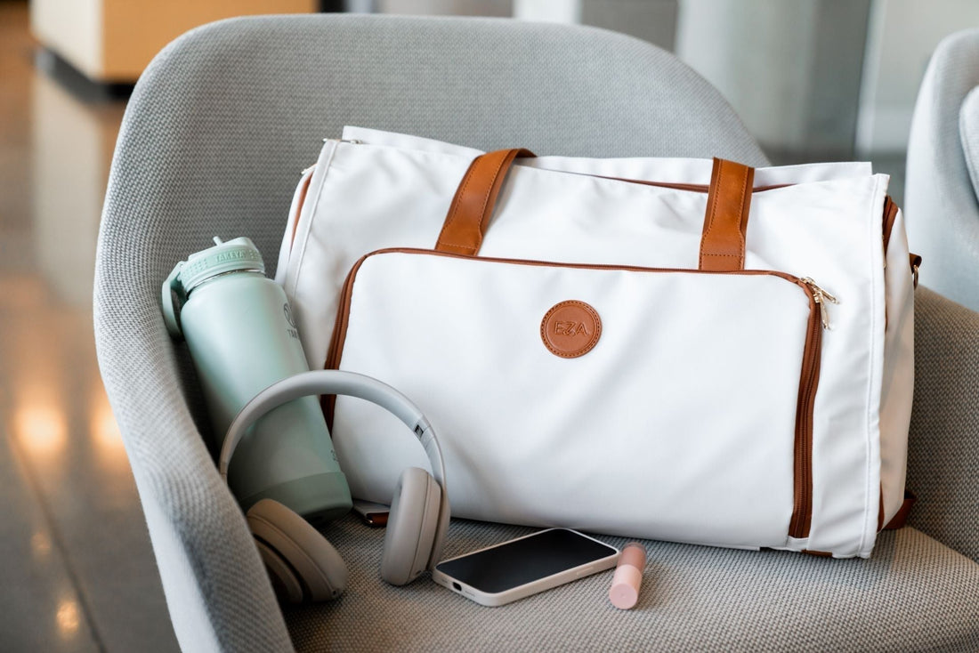 High-quality Caribbean convertible duffle bag with headphones, phone, and water bottle for versatile travel.