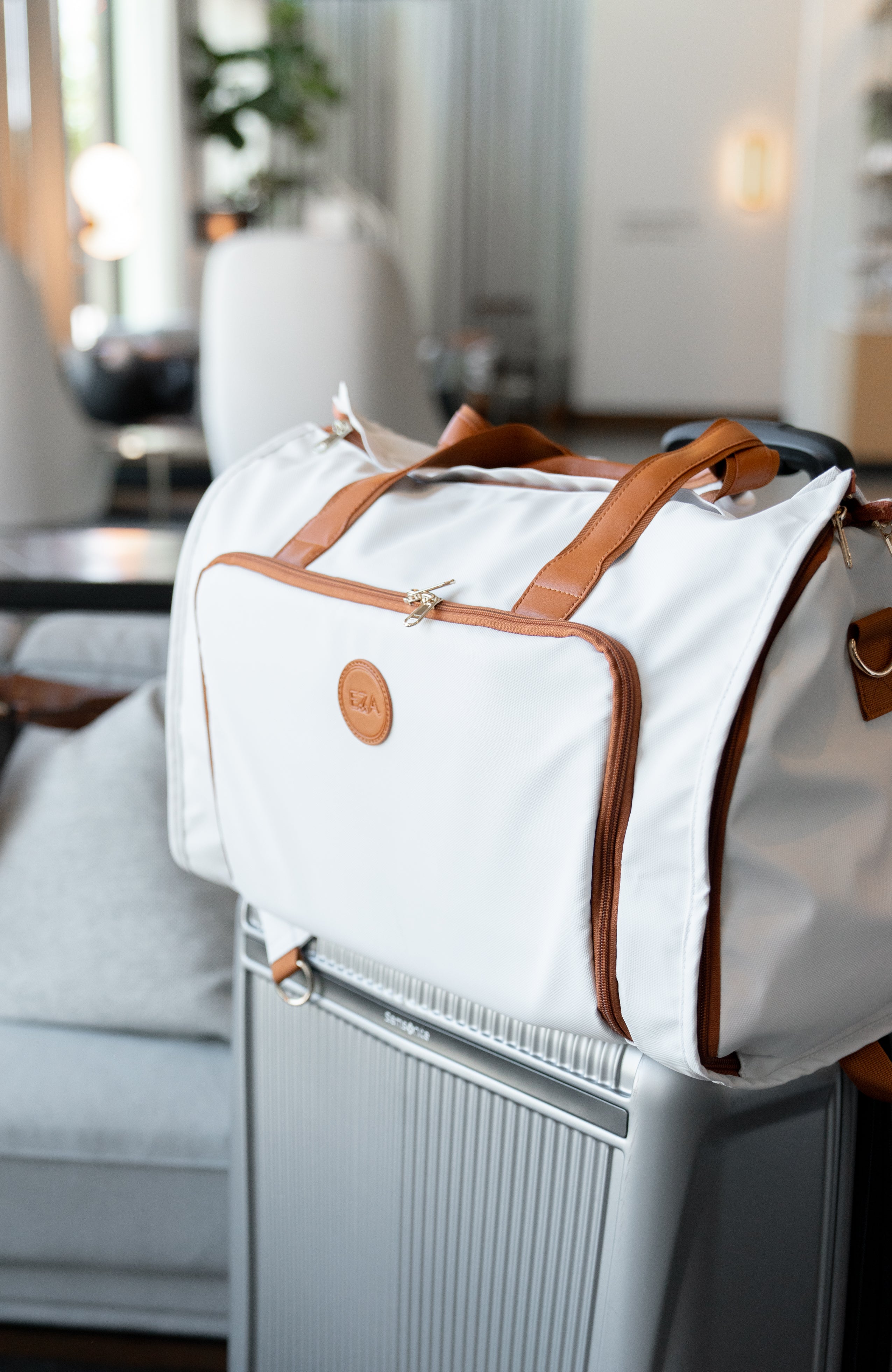 Stylish convertible duffle bag on a suitcase, perfect as a 3-in-1 travel bag for adventures and everyday use.