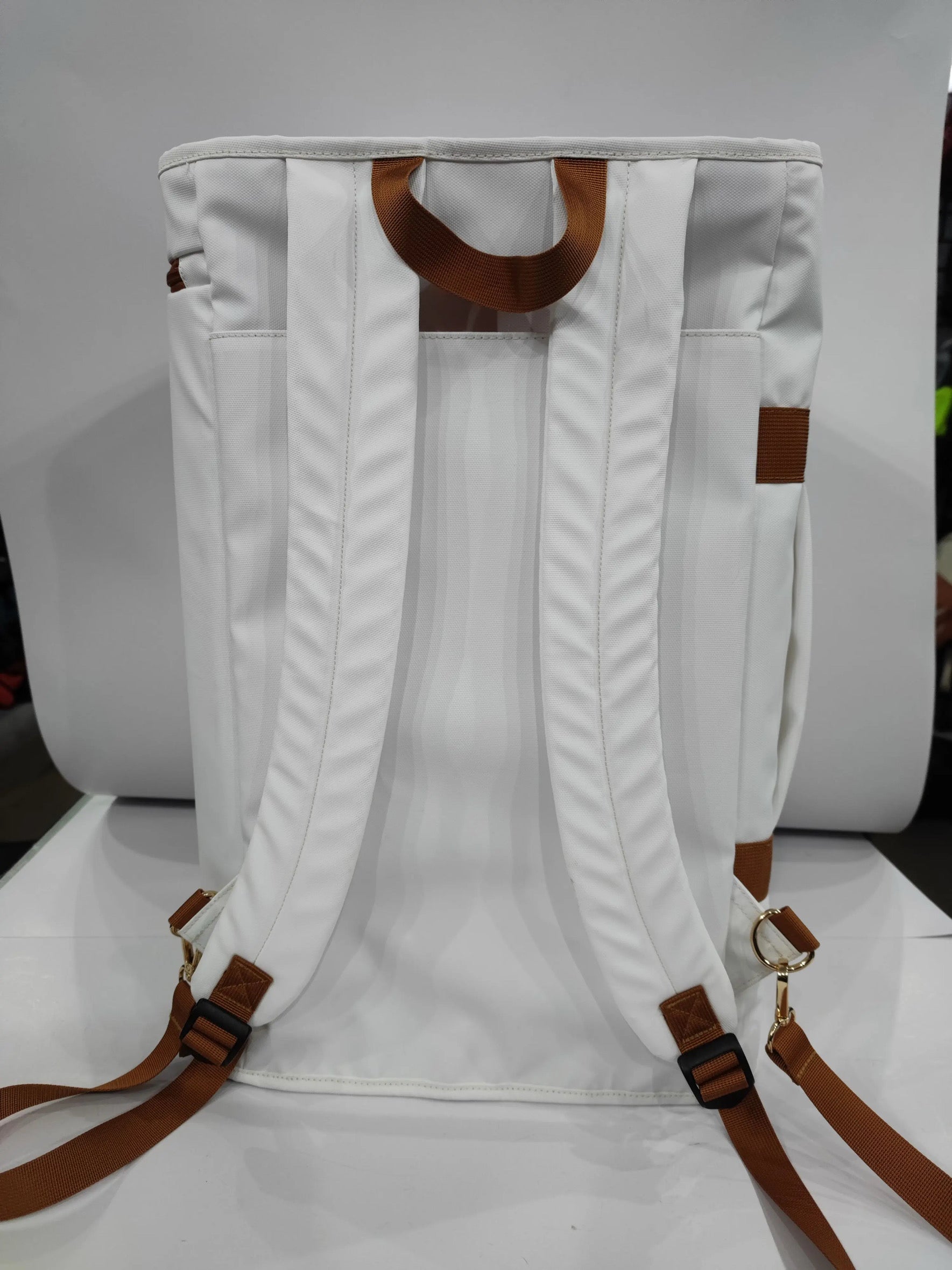 Back view of the Caribbean Convertible Duffel, showcasing its white fabric, adjustable straps for backpack use.