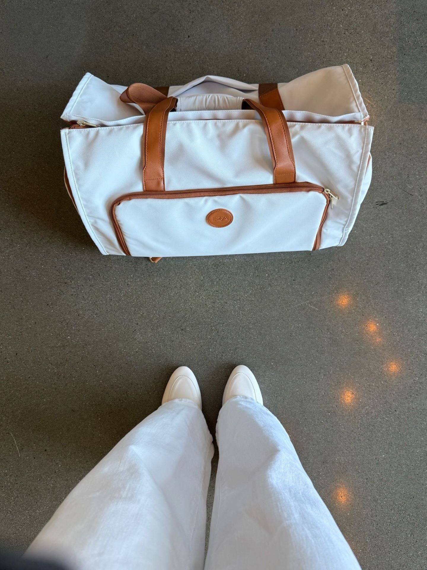 Stylish convertible duffle bag with leather straps, perfect 3-in-1 lightweight travel gear for all adventures.